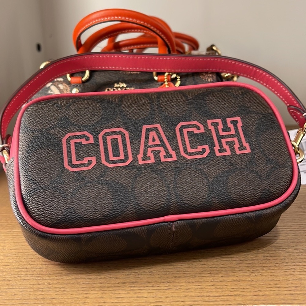 Coach Jamie Wristlet In Signature Canvas With Varsity Motif
IM/Brown/Watermelon - Picture 16 of 16